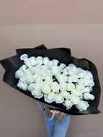 Bouquet of 60 white roses wrapped in black paper