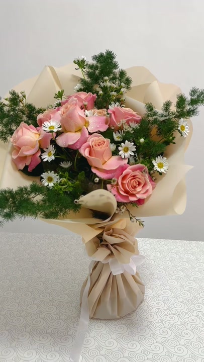 9 roses and aster in fine pine foliage