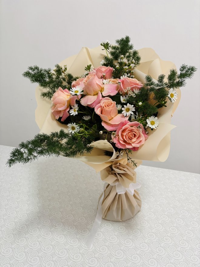 9 roses and aster in fine pine foliage