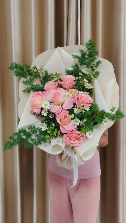 9 roses and aster in fine pine foliage